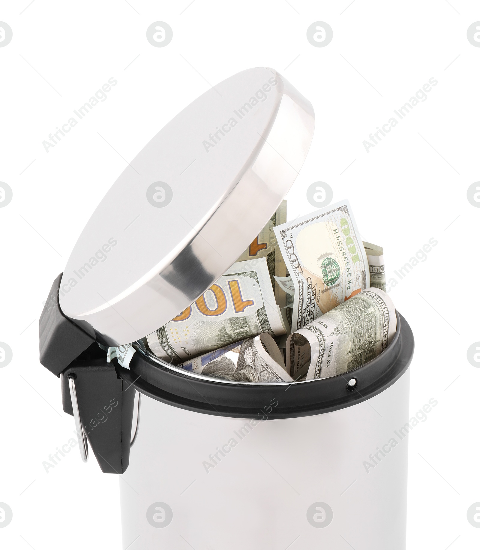 Photo of Dollar banknotes in trash bin on white background