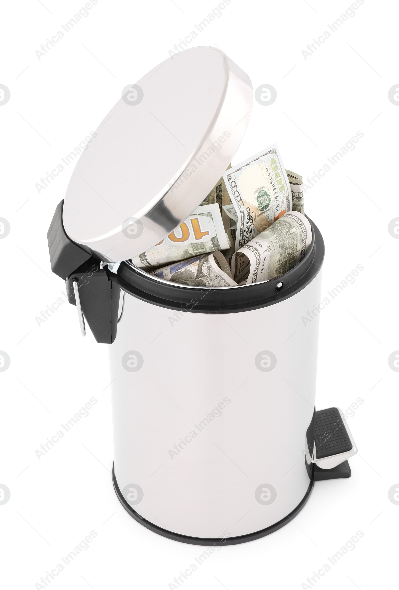Photo of Dollar banknotes in trash bin on white background