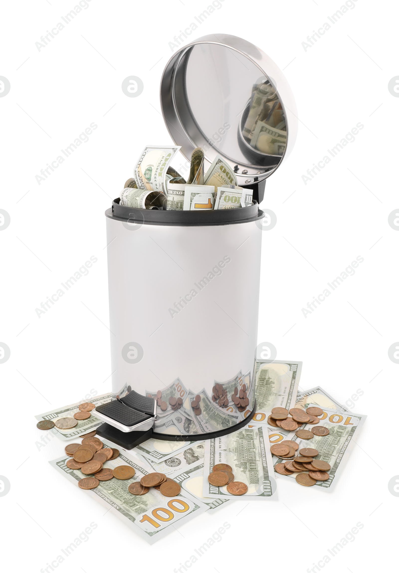 Photo of Dollar banknotes in trash bin and coins on white background