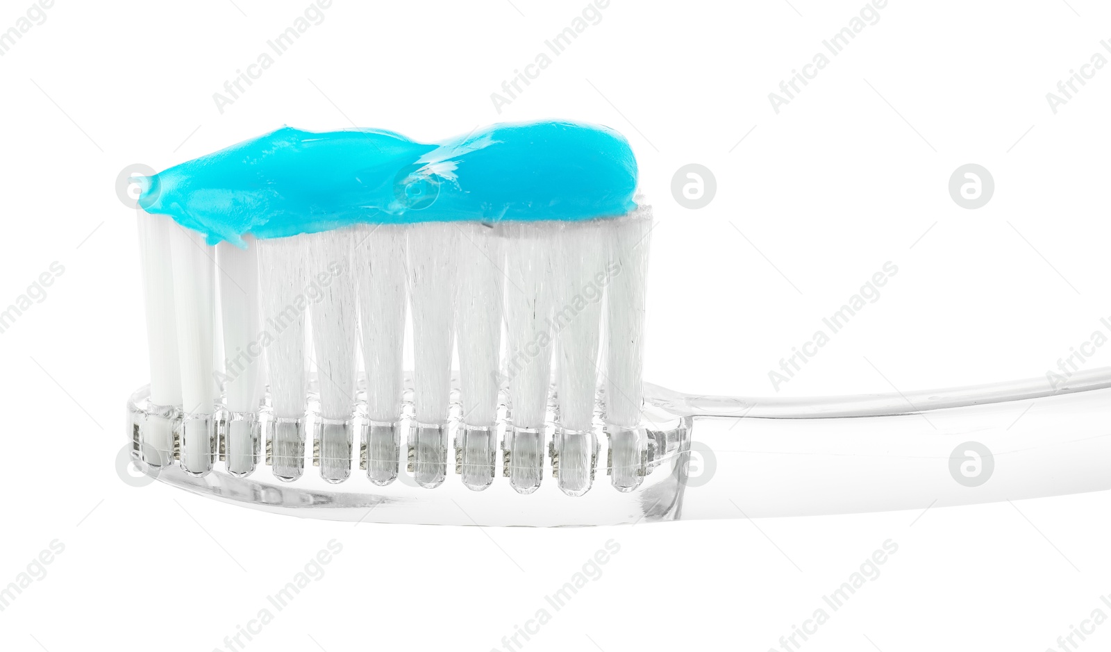 Photo of One toothbrush with toothpaste in air isolated on white