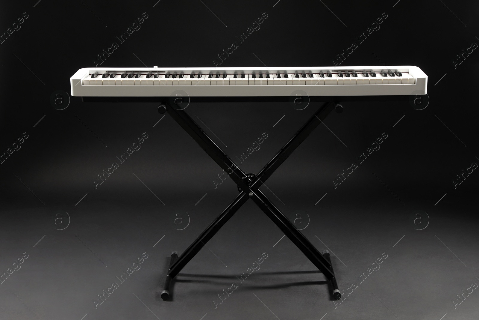 Photo of Synthesizer on black background. Electronic musical instrument