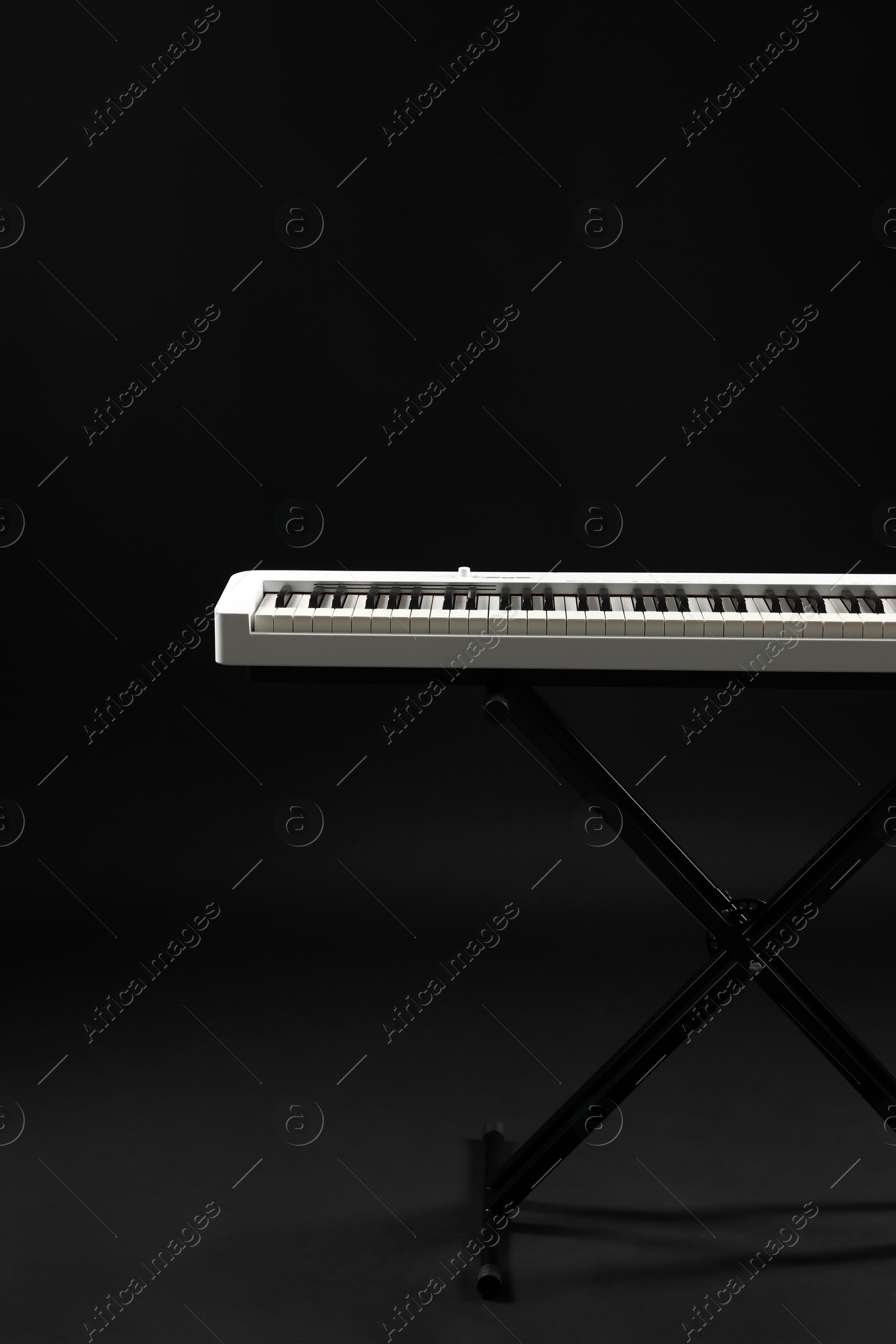 Photo of Synthesizer on black background. Electronic musical instrument