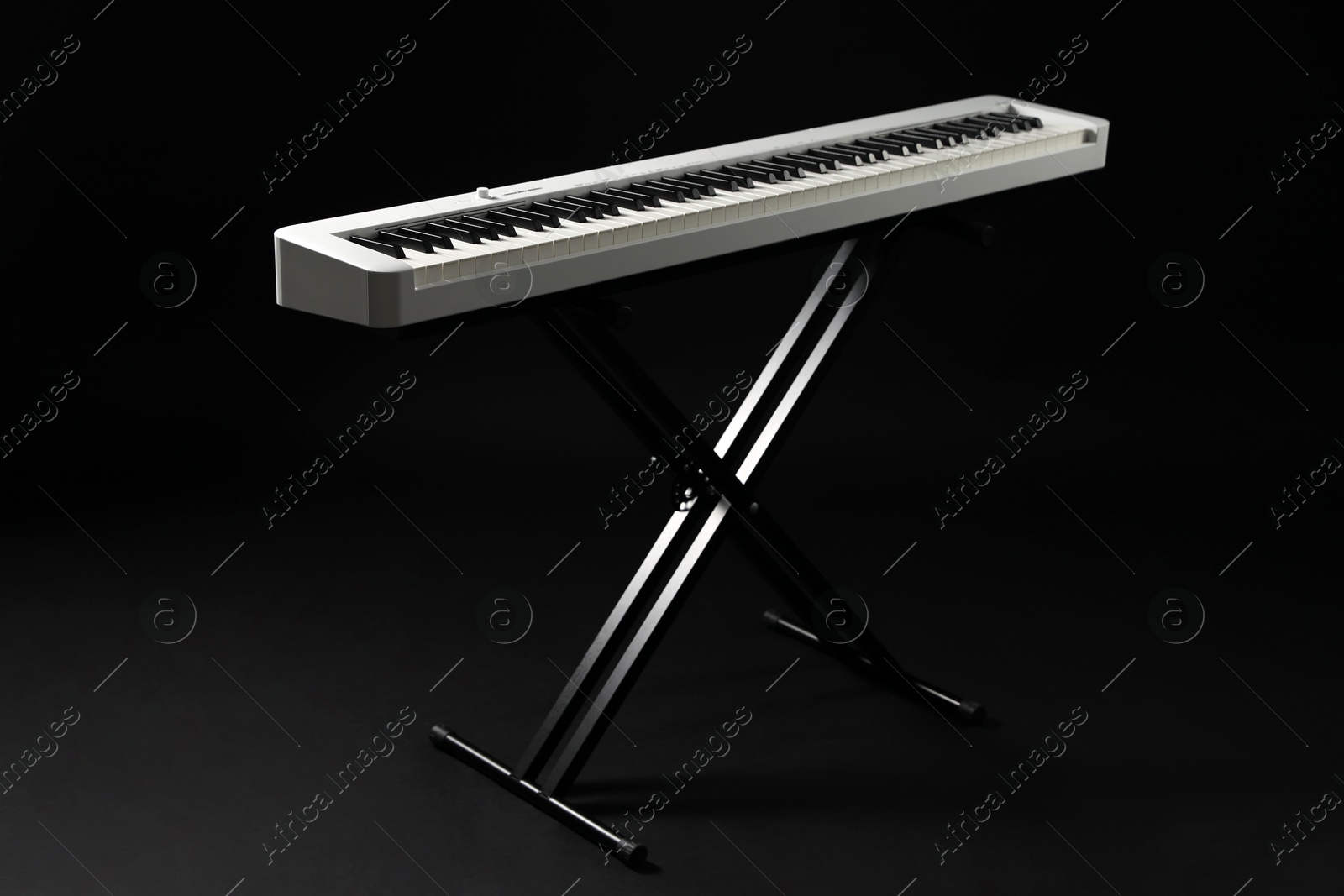 Photo of Synthesizer on black background. Electronic musical instrument