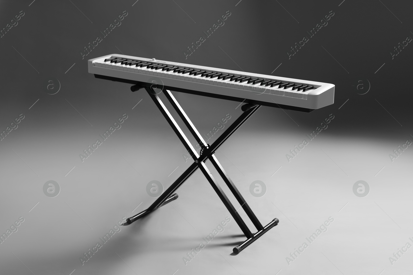 Photo of Synthesizer on grey background. Electronic musical instrument