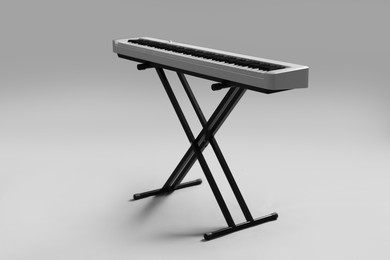 Photo of Synthesizer on grey background. Electronic musical instrument