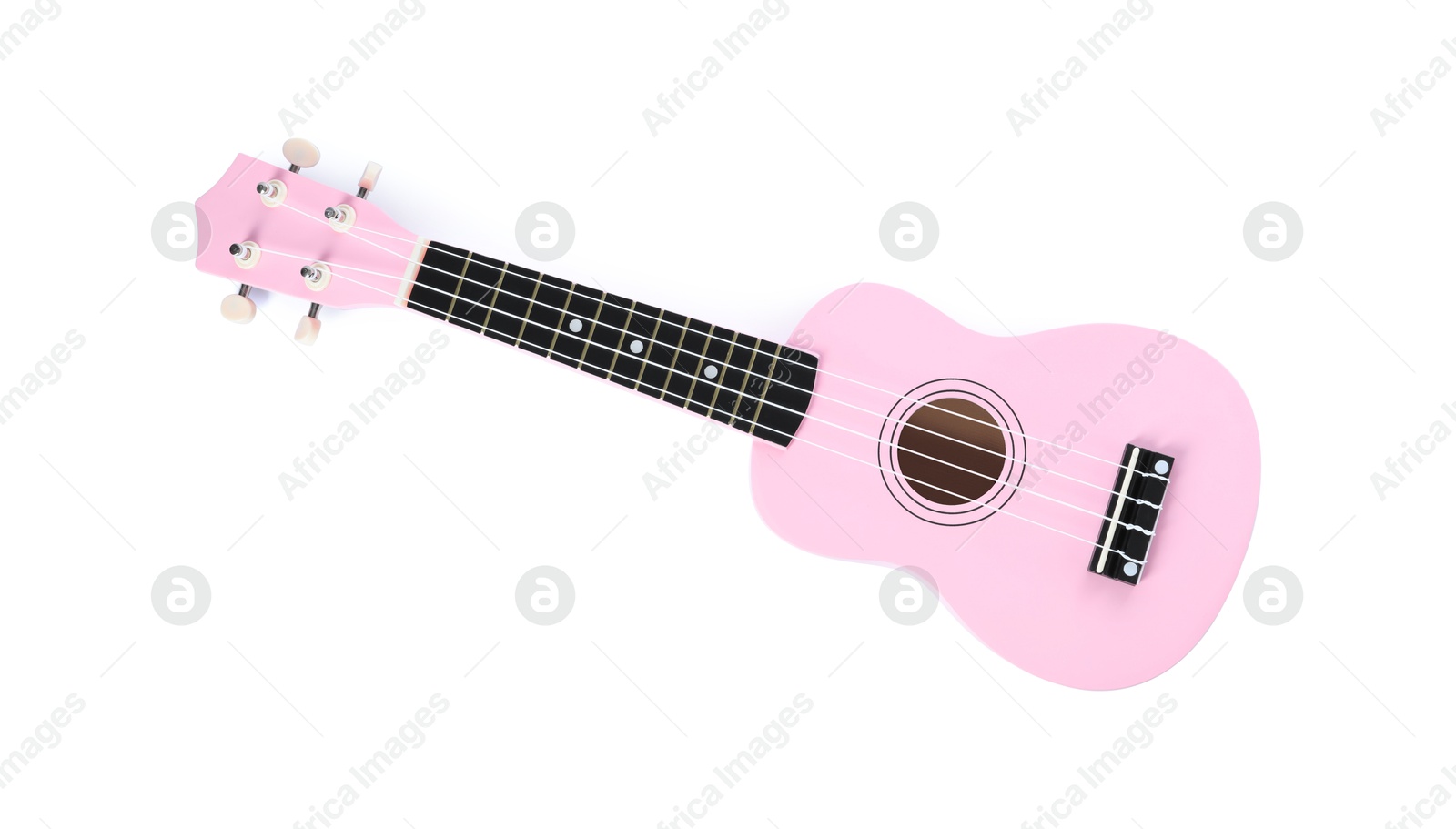 Photo of One ukulele isolated on white, top view. String musical instrument