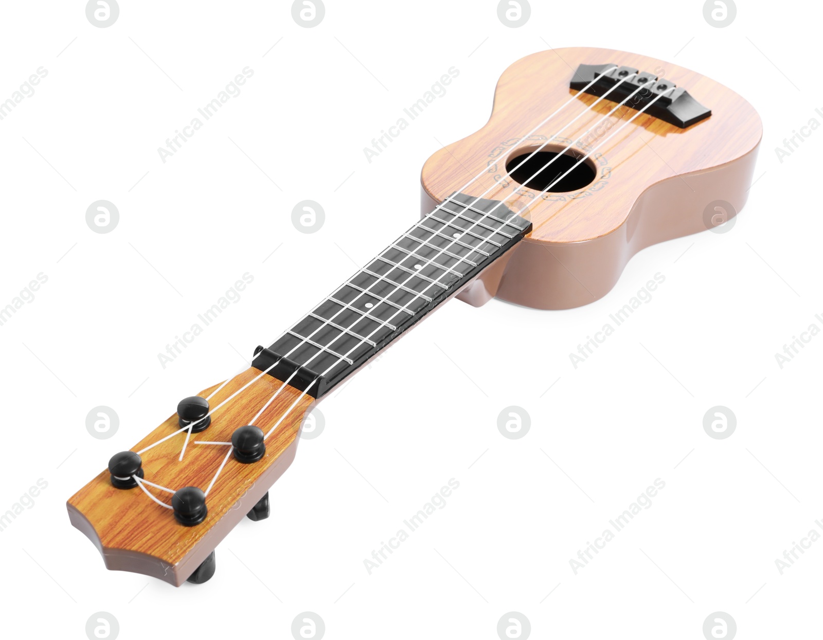 Photo of One ukulele isolated on white. String musical instrument