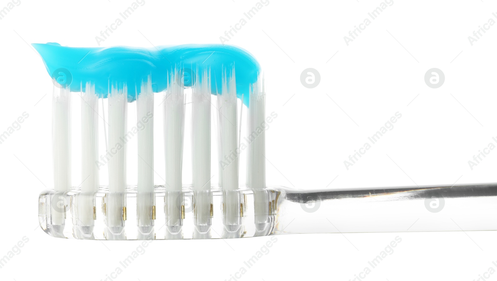 Photo of One toothbrush with toothpaste in air isolated on white