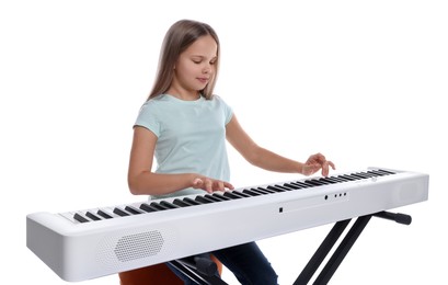 Cute girl playing synthesizer on white background