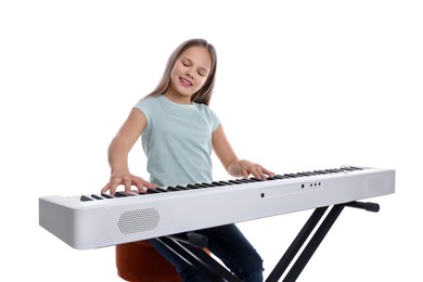 Photo of Cute girl playing synthesizer on white background