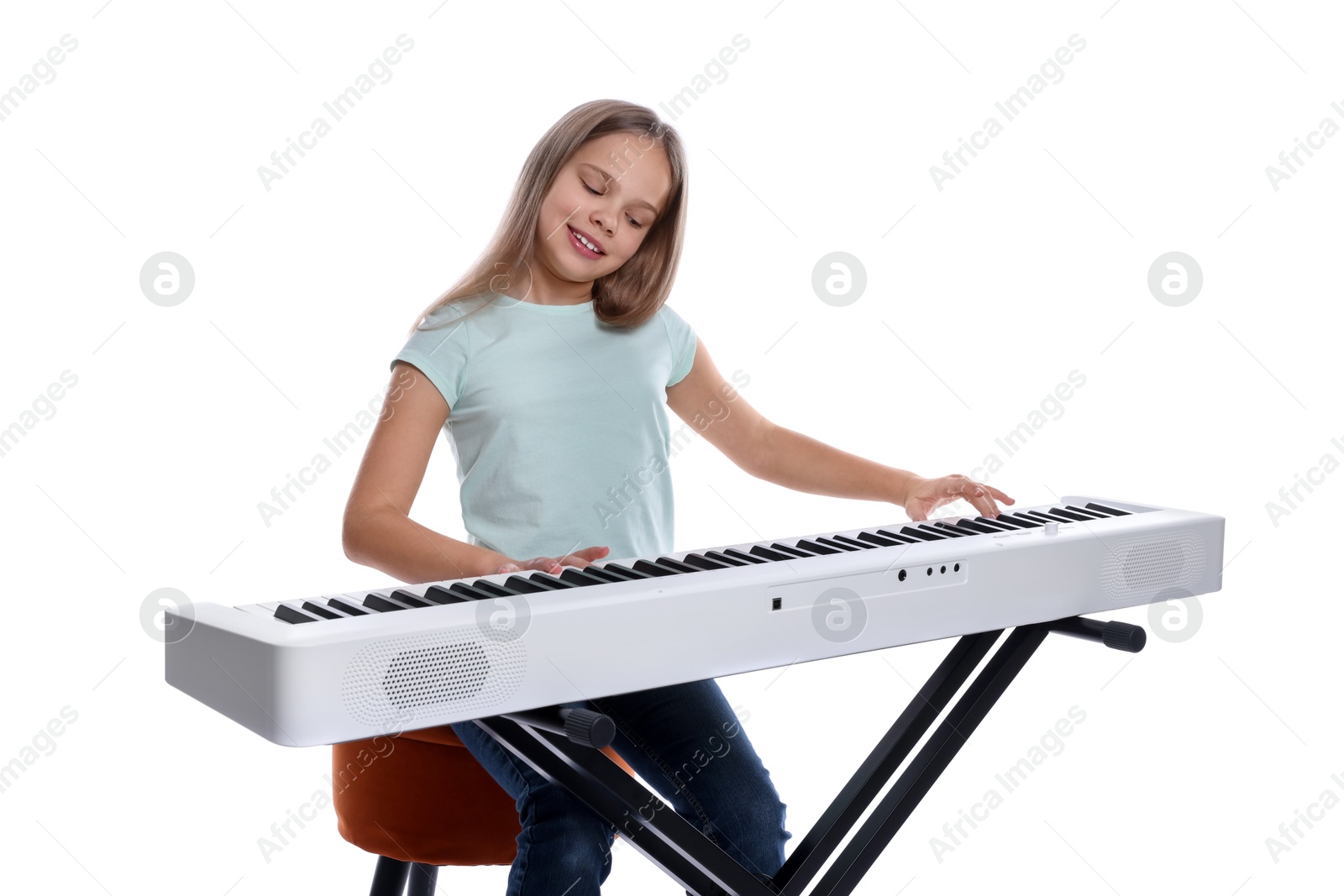 Photo of Cute girl playing synthesizer on white background