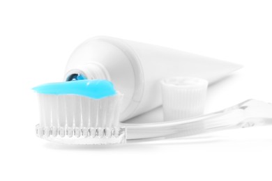 Photo of Toothbrush with toothpaste and tube isolated on white