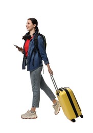 Young tourist with suitcase and passport on white background