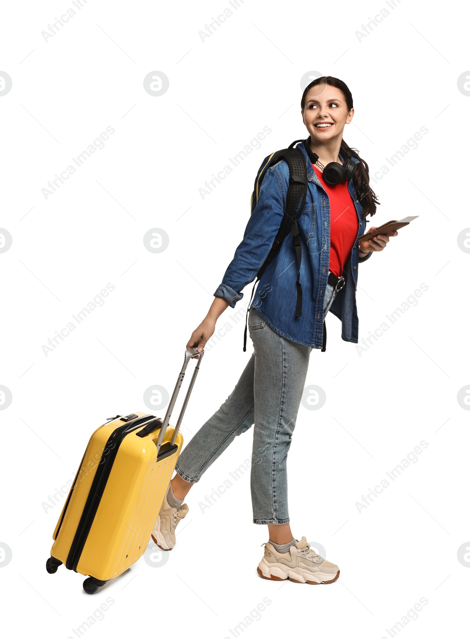 Photo of Young tourist with suitcase and passport on white background