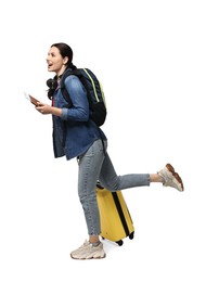 Photo of Young tourist with suitcase and passport on white background