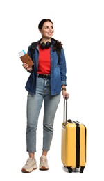 Photo of Young tourist with suitcase and passport on white background