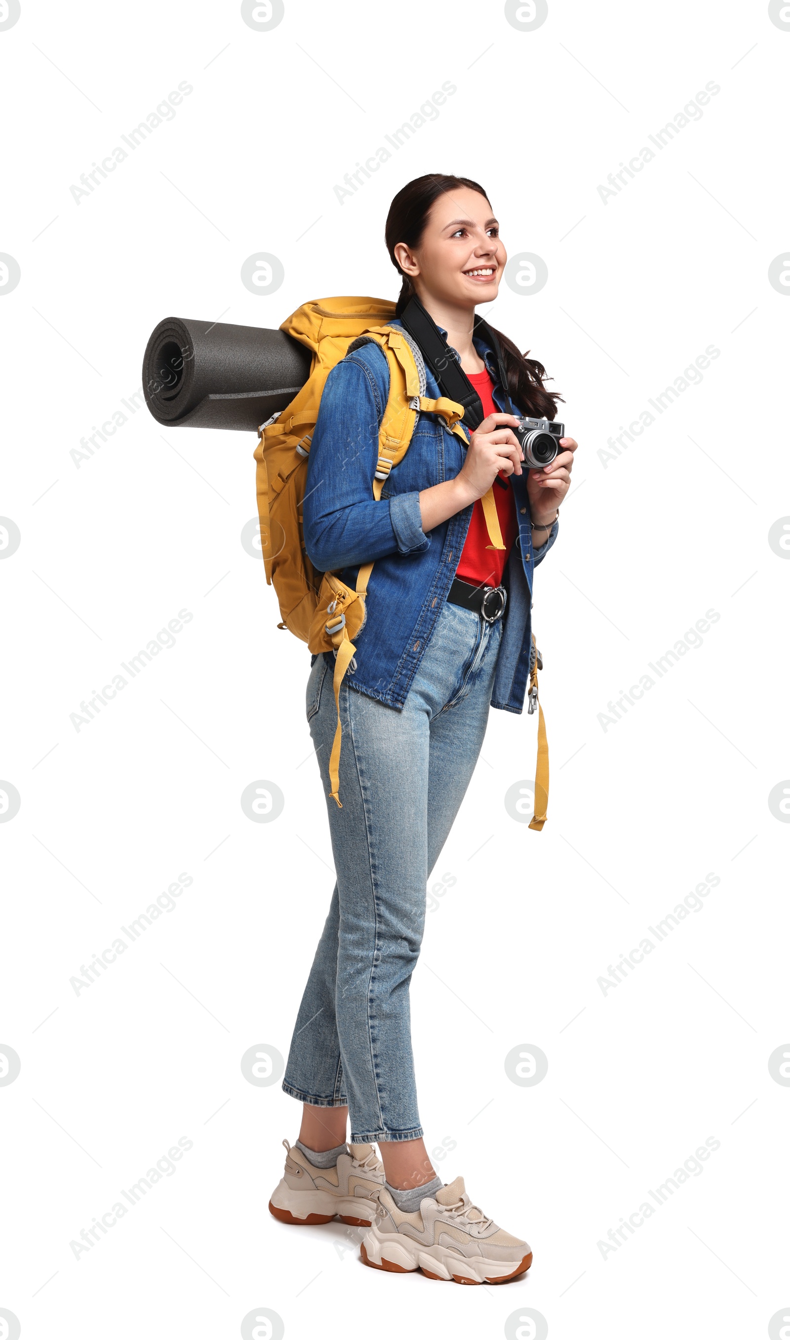 Photo of Young tourist with camera and backpack on white background