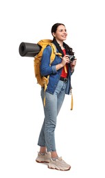 Young tourist with camera and backpack on white background