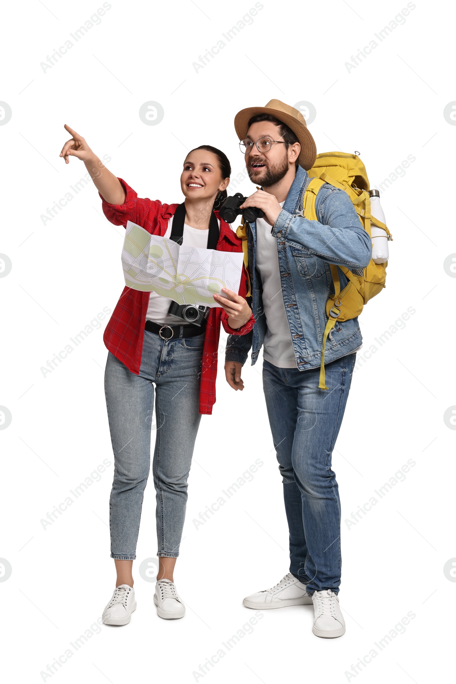 Photo of Tourism. Happy couple with backpack, map and binoculars on white background