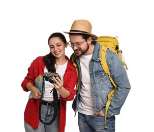 Tourism. Happy couple with backpack and camera on white background