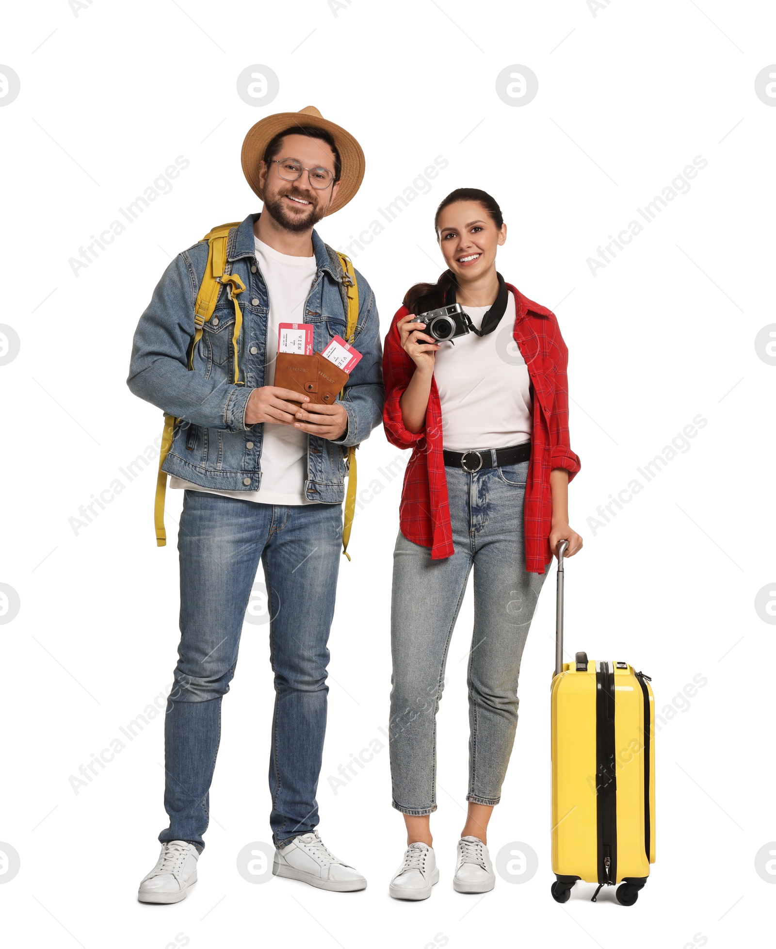 Photo of Tourism. Happy couple with passports, tickets, camera and suitcase on white background