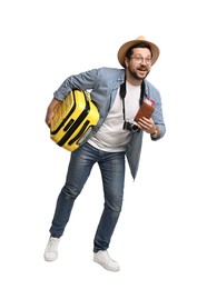 Photo of Happy tourist in hat with suitcase, passport and ticket on white background