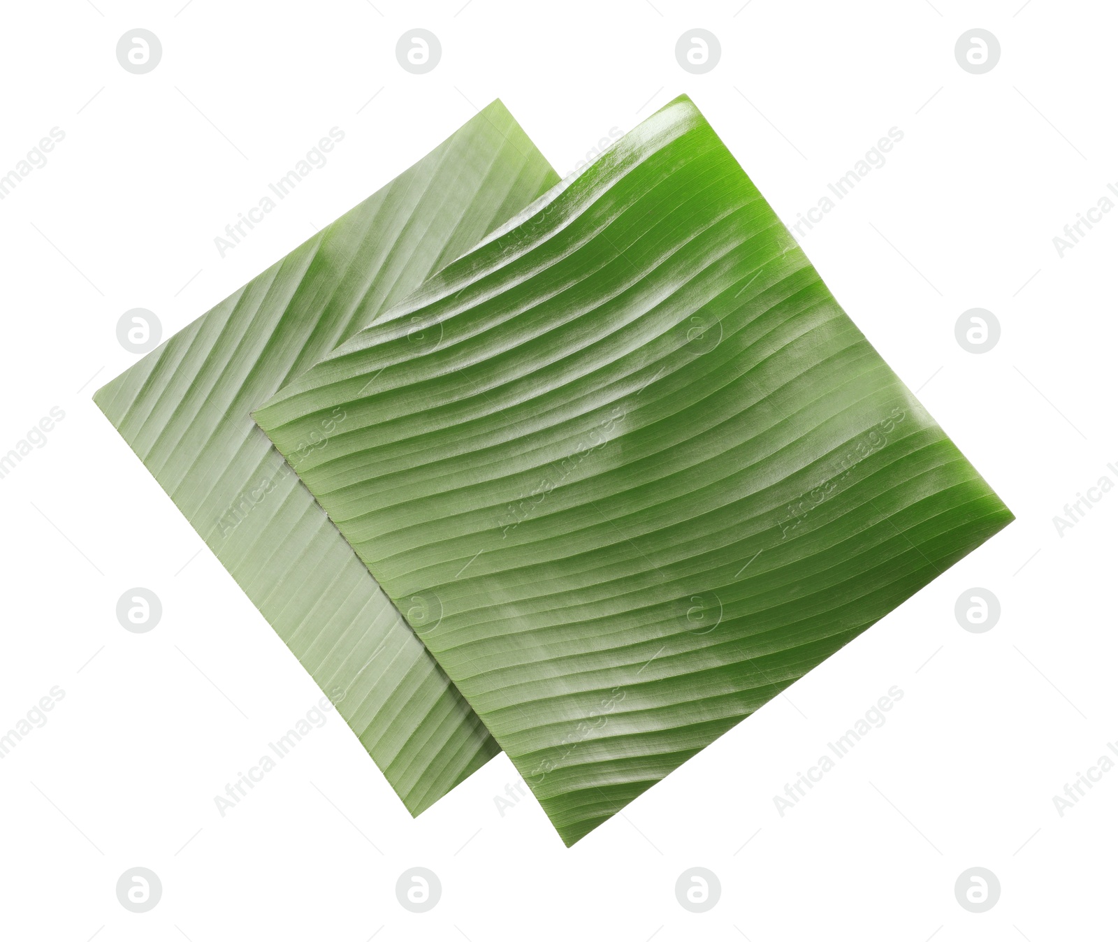 Photo of Pieces of banana leaves isolated on white, top view. Traditional meal serving