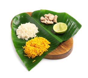 Photo of Cut banana leaf with different food isolated on white. Healthy eco serving