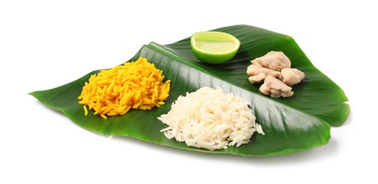 Photo of Cut banana leaf with different food isolated on white. Healthy eco serving