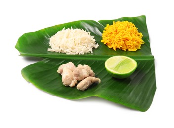 Photo of Cut banana leaf with different food isolated on white. Healthy eco serving