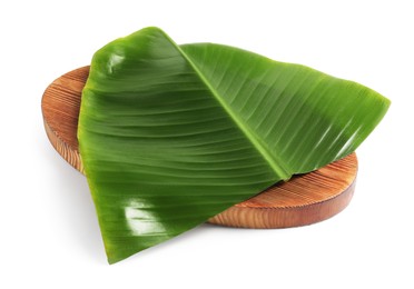 Photo of Board with cut banana leaf isolated on white. Healthy eco serving