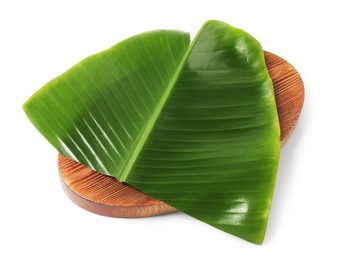 Photo of Board with cut banana leaf isolated on white. Healthy eco serving