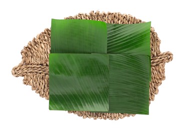 Photo of Pieces of banana leaves isolated on white, top view. Traditional meal serving