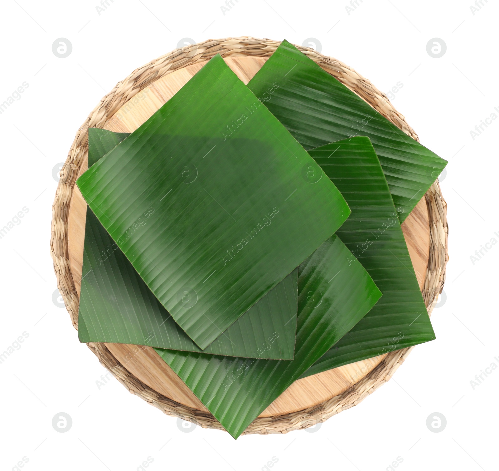 Photo of Pieces of banana leaves isolated on white, top view. Traditional meal serving