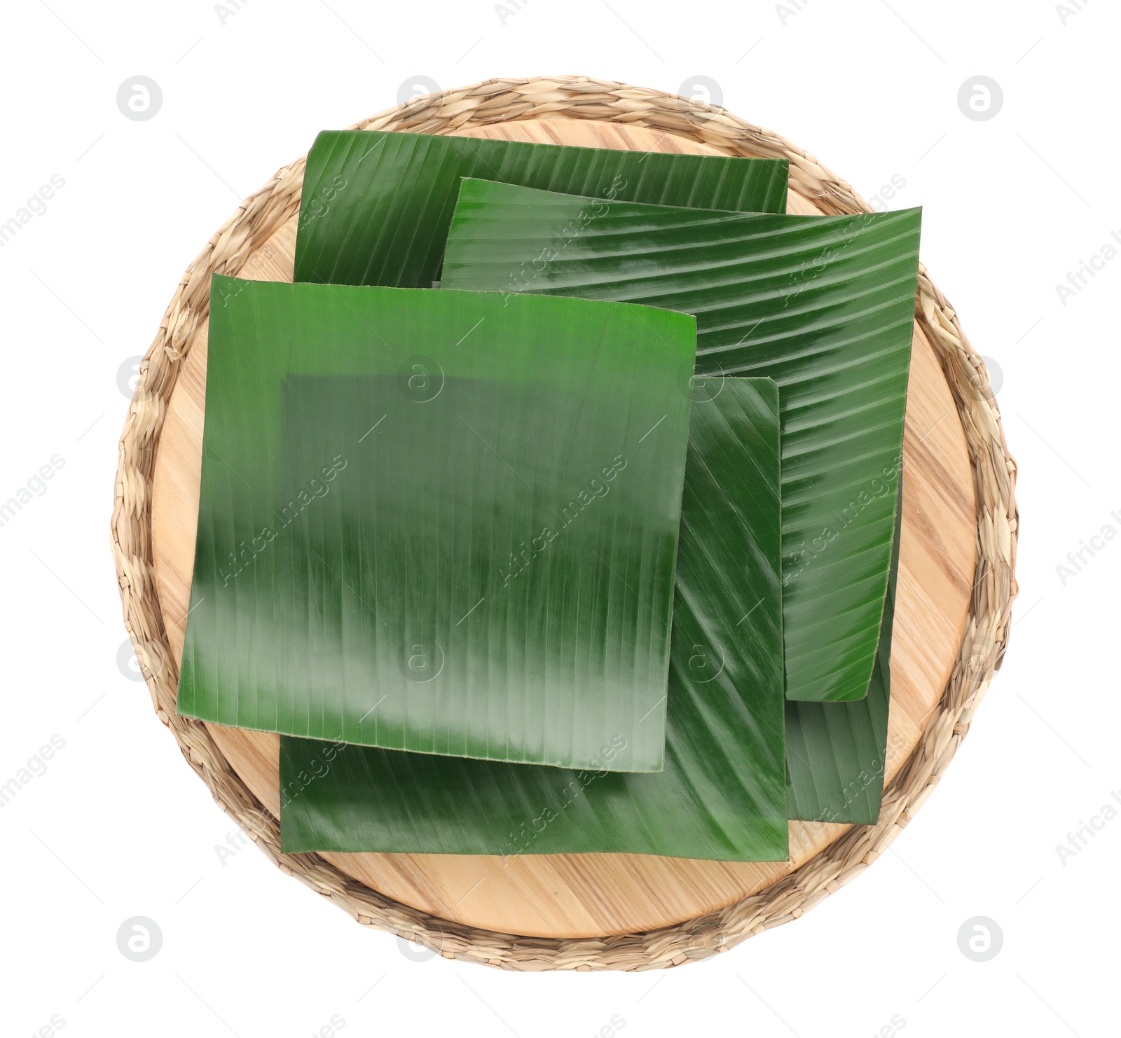 Photo of Pieces of banana leaves isolated on white, top view. Traditional meal serving