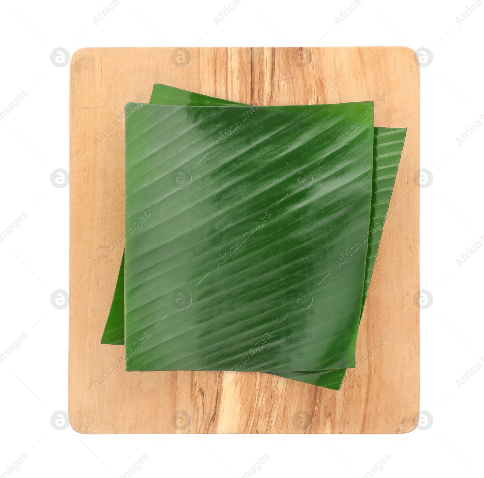 Photo of Pieces of banana leaves isolated on white, top view. Traditional meal serving