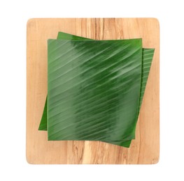 Photo of Pieces of banana leaves isolated on white, top view. Traditional meal serving