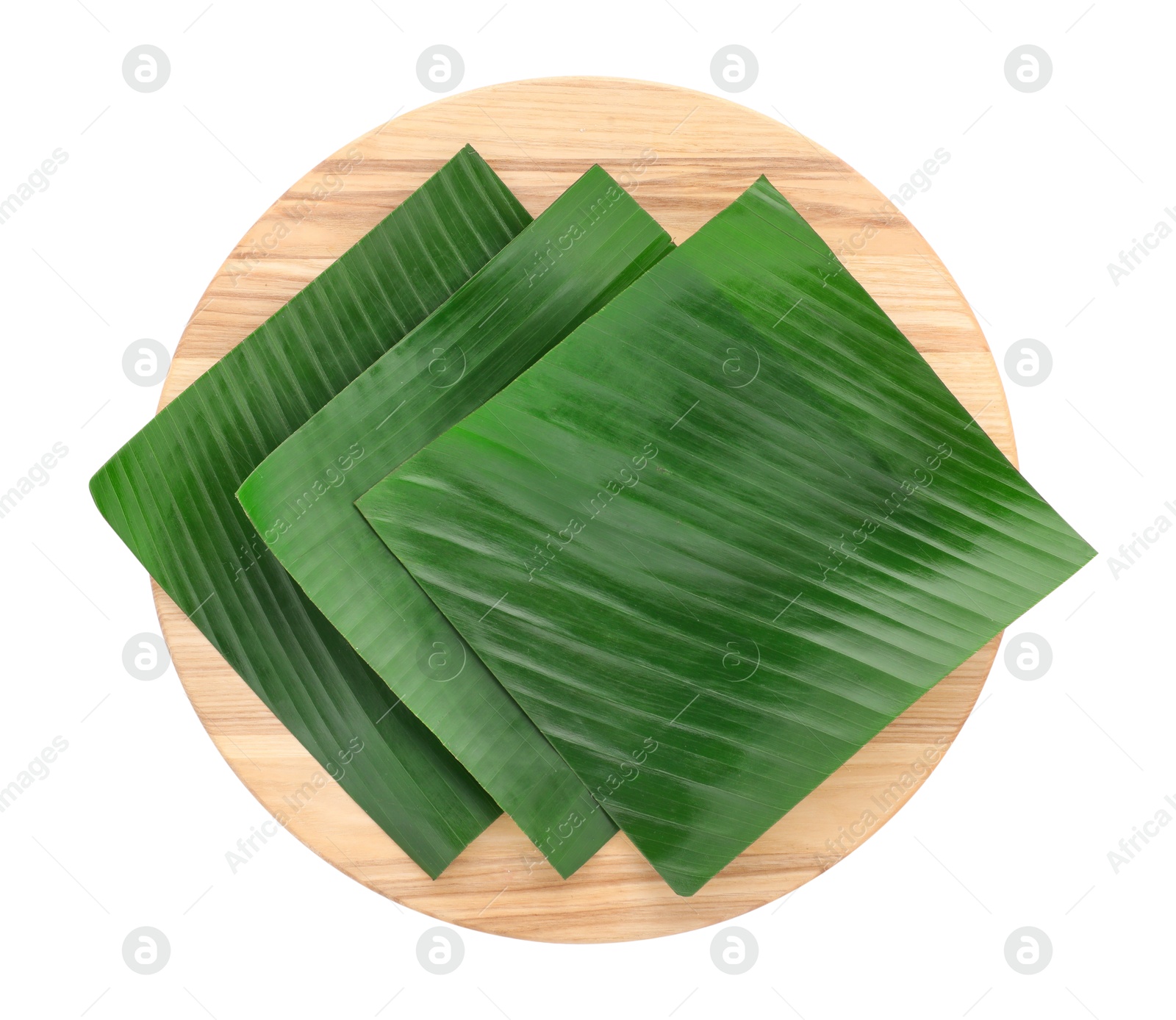 Photo of Pieces of banana leaves isolated on white, top view. Traditional meal serving