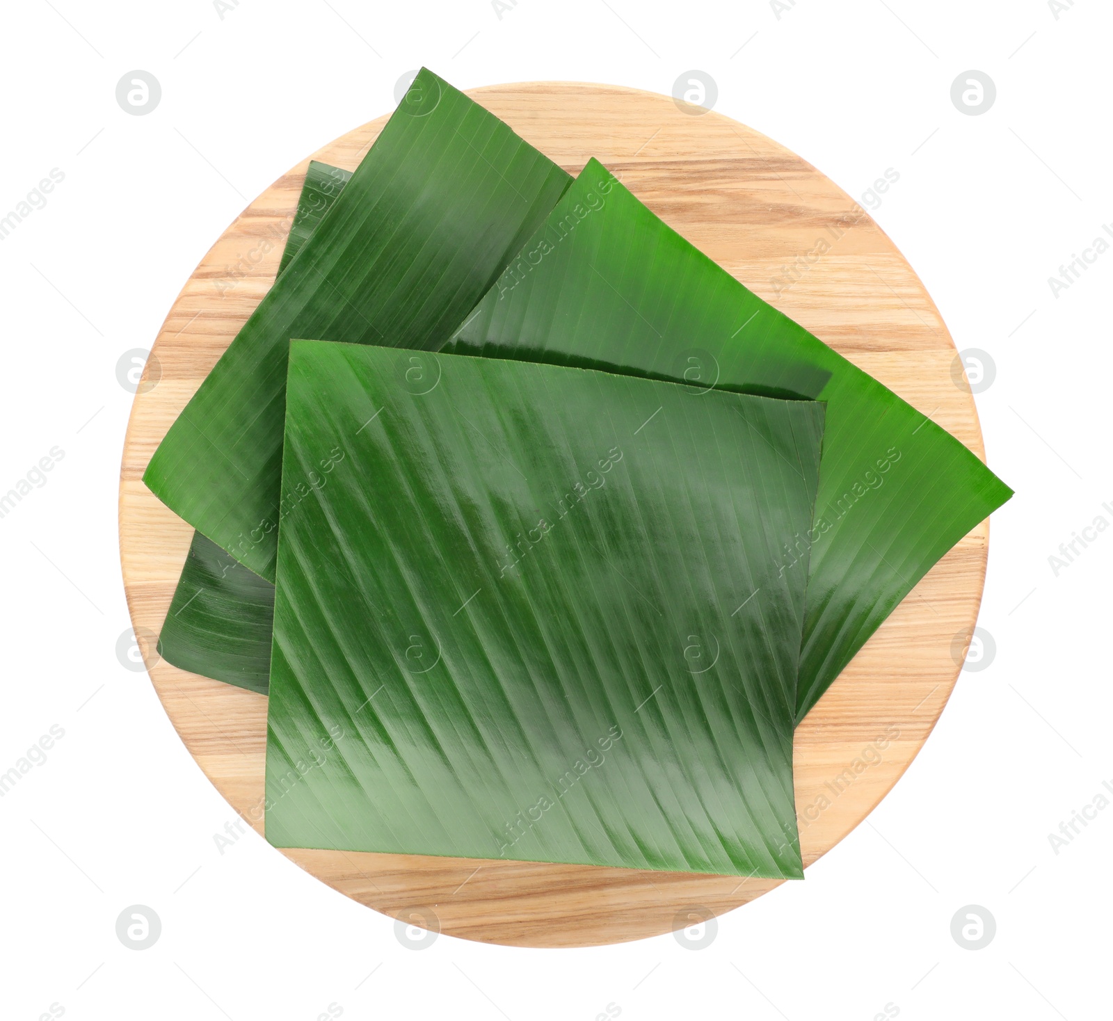 Photo of Pieces of banana leaves isolated on white, top view. Traditional meal serving