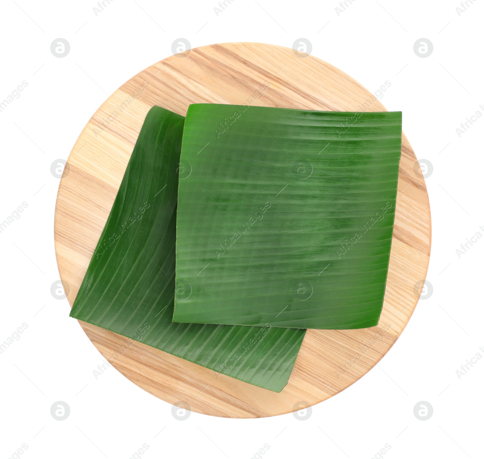 Photo of Pieces of banana leaves isolated on white, top view. Traditional meal serving