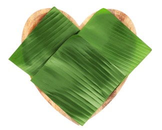 Photo of Pieces of banana leaves isolated on white, top view. Traditional meal serving