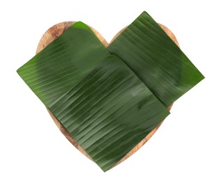 Photo of Pieces of banana leaves isolated on white, top view. Traditional meal serving