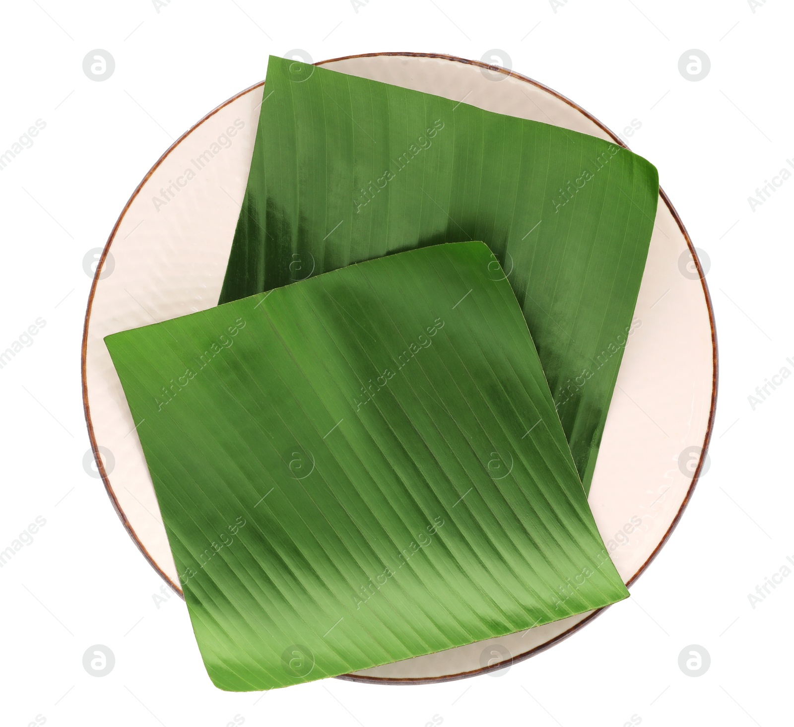 Photo of Pieces of banana leaves isolated on white, top view. Traditional meal serving