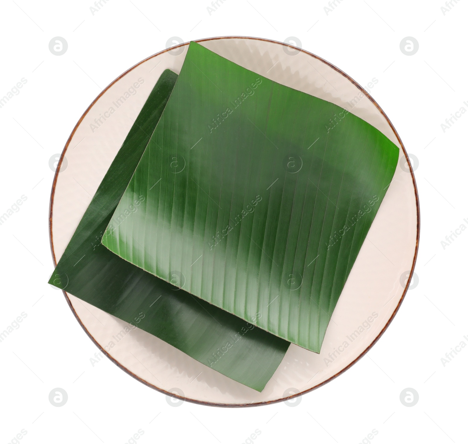 Photo of Pieces of banana leaves isolated on white, top view. Traditional meal serving