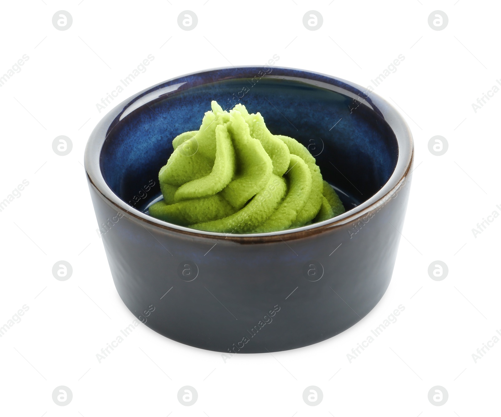 Photo of Hot wasabi paste in bowl isolated on white