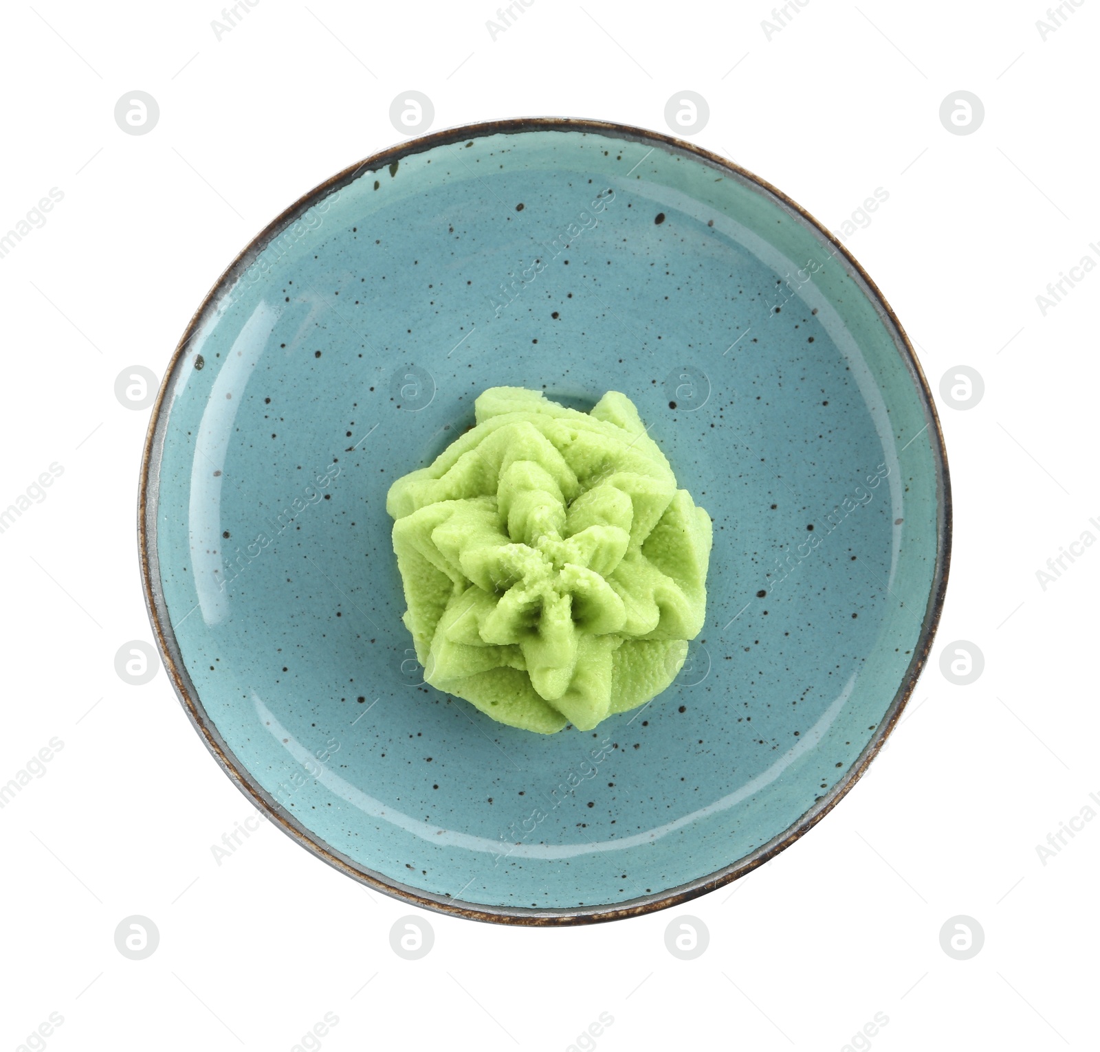 Photo of Plate with hot wasabi paste isolated on white, top view