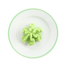 Photo of Plate with hot wasabi paste isolated on white, top view