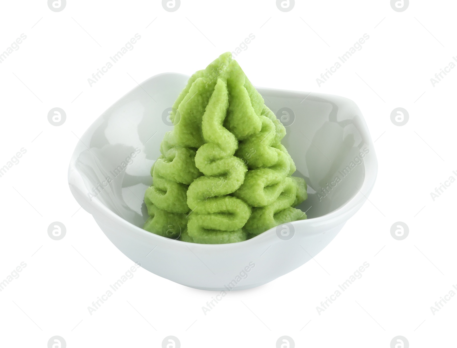 Photo of Hot wasabi paste in bowl isolated on white