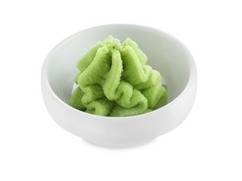 Photo of Hot wasabi paste in bowl isolated on white