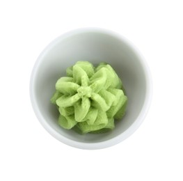 Photo of Hot wasabi paste in bowl isolated on white, top view